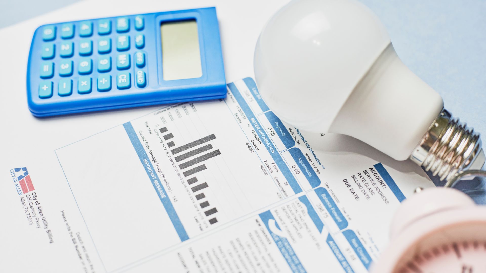 Image of a utility bill and a calculator