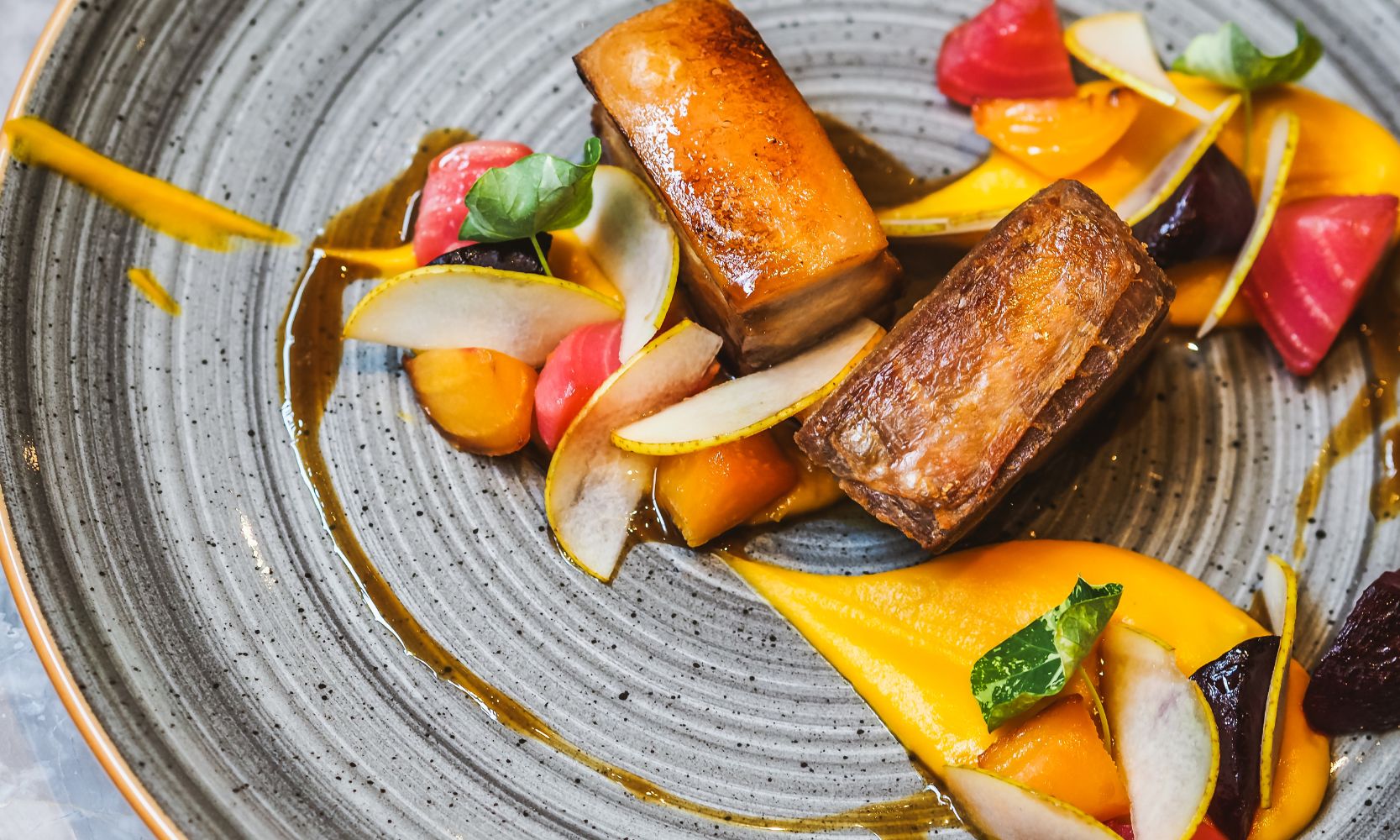 Image of upscale dining plate with bright, colorful food on it