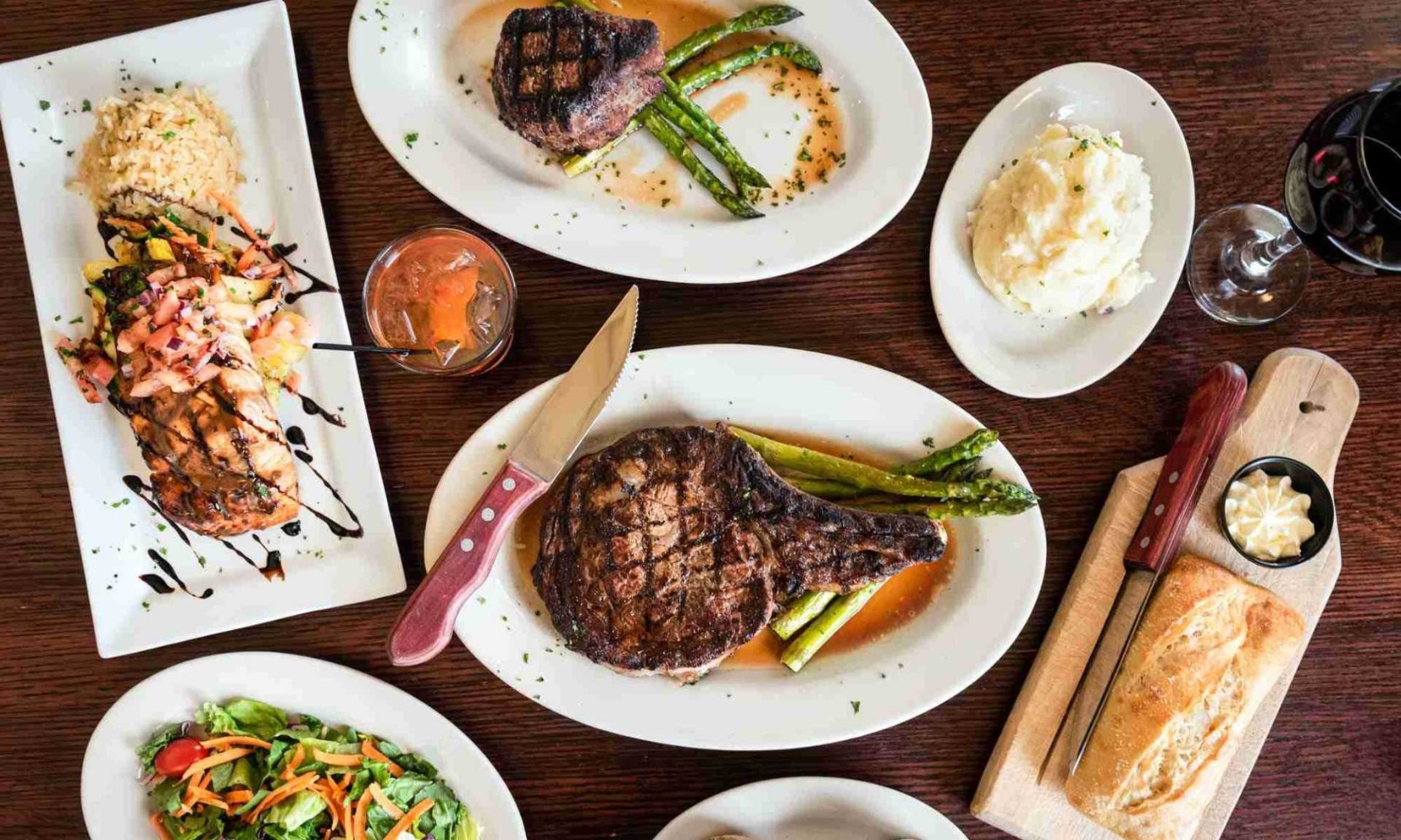 Top-view image of steak entrees with sides at Jameson's Charhouse in Arlington Heights, IL