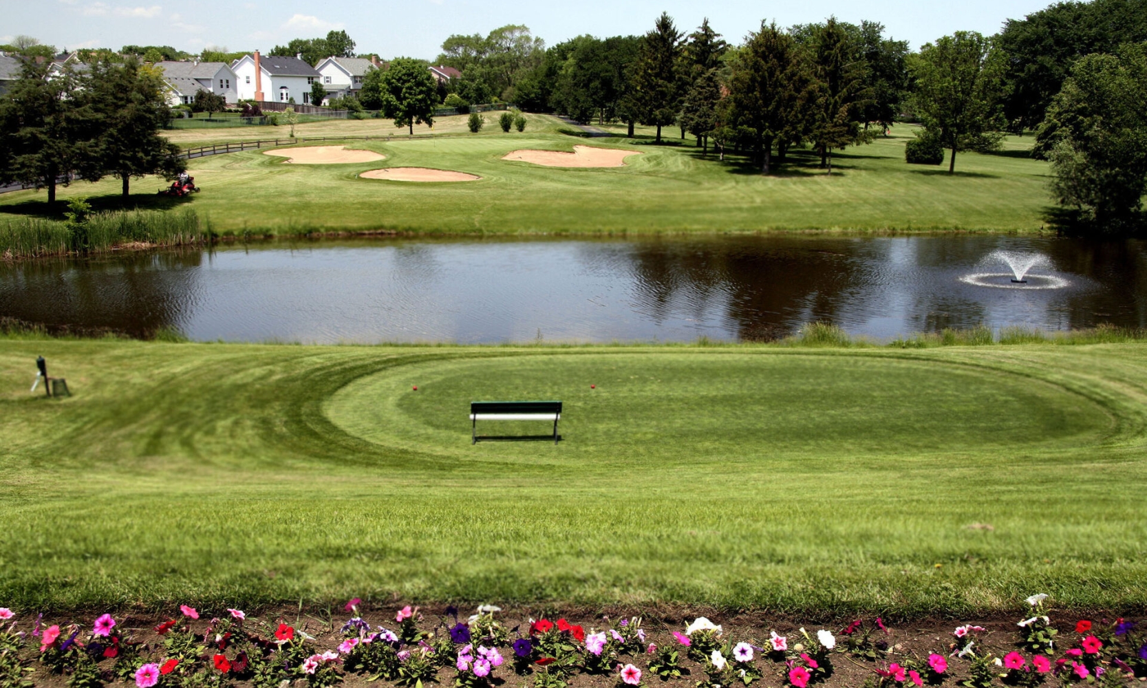 Image of the Vernon Hills Golf Course with water, flowers, and greenery in Vernon Hills, IL