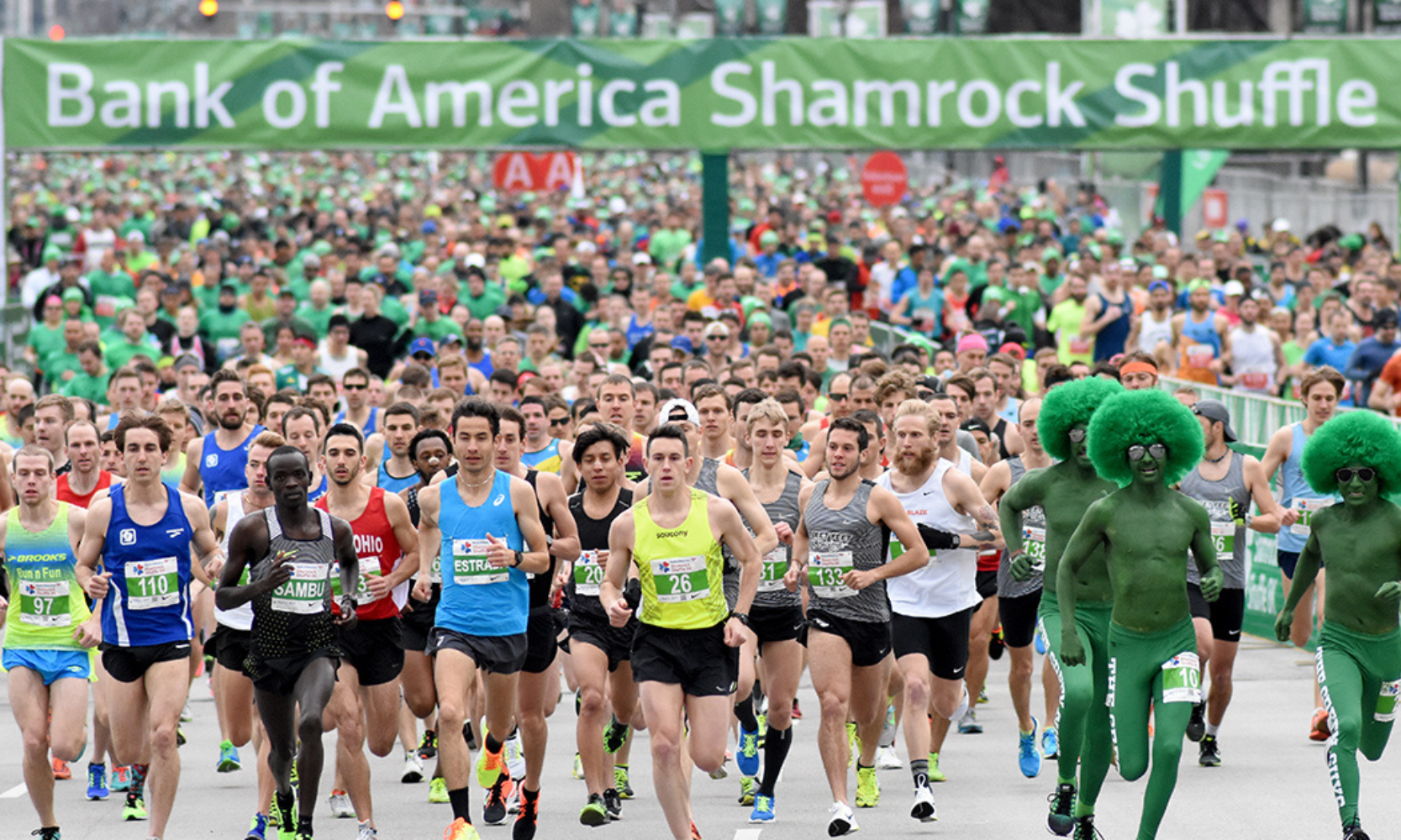 View of marathon runners in St. Patrick's Day costumes and athletic gear at the Shamrock Shuffle in Chicago