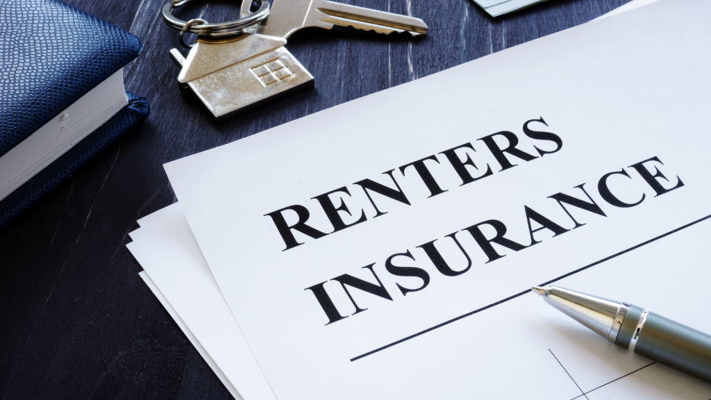 Closeup image of a renters insurance document on a desk with a pen and keys