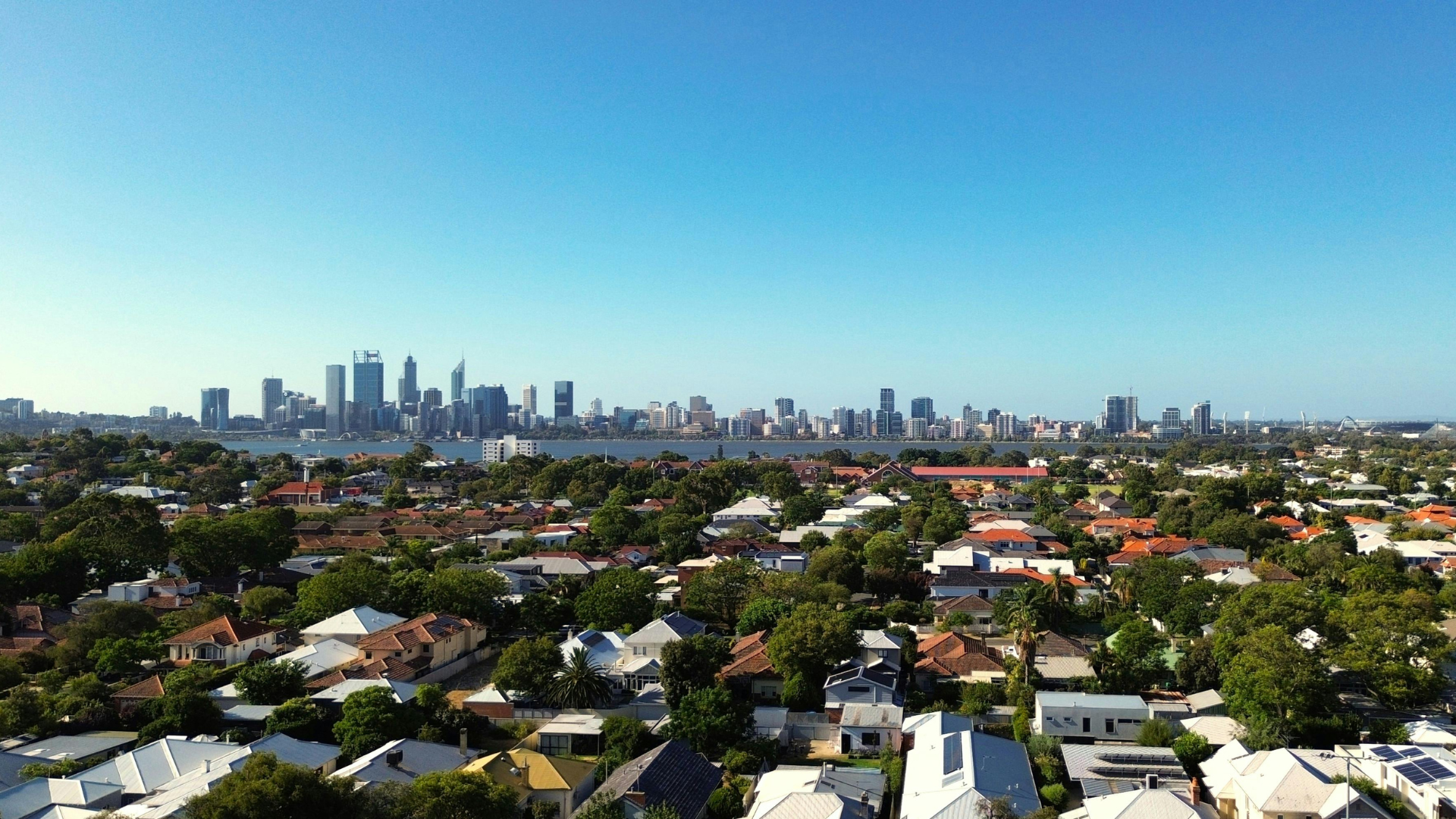 Wideshot image of a suburban neighborhood overlooking the Chicago skyline